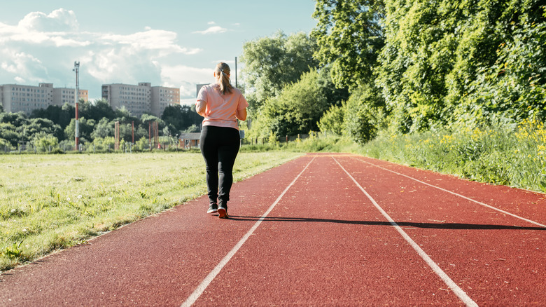 Woman walking on track