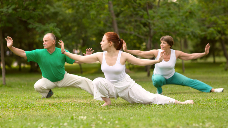 Group of people practicing tai chi