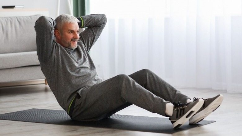 Older man doing crunches