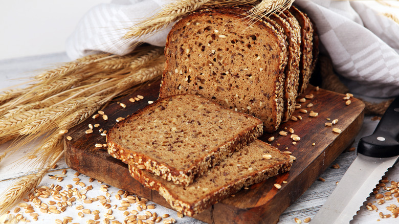 Whole grain rye bread on a cutting board