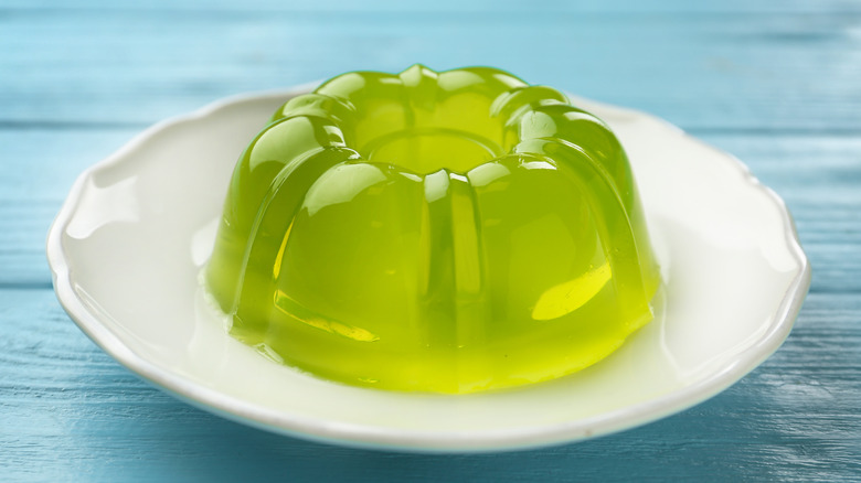 Green gelatin mold on a white plate