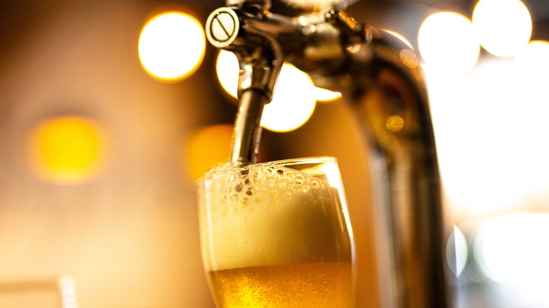 Beer tap and glasses in a pub