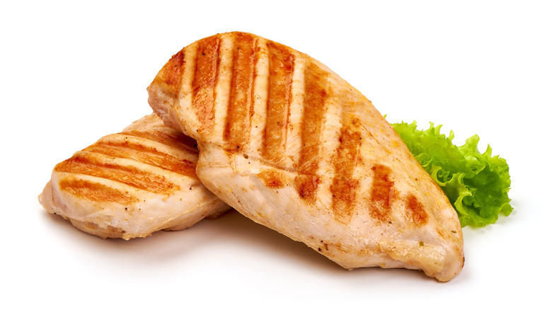 Close-up of two pieces of cooked chicken breast 