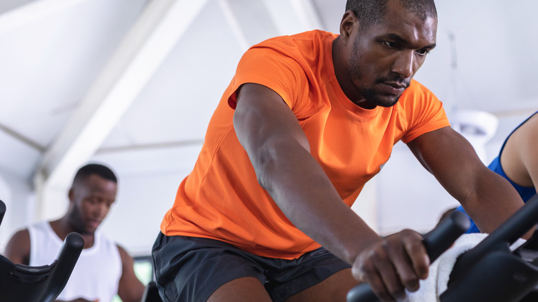 men on spin bikes