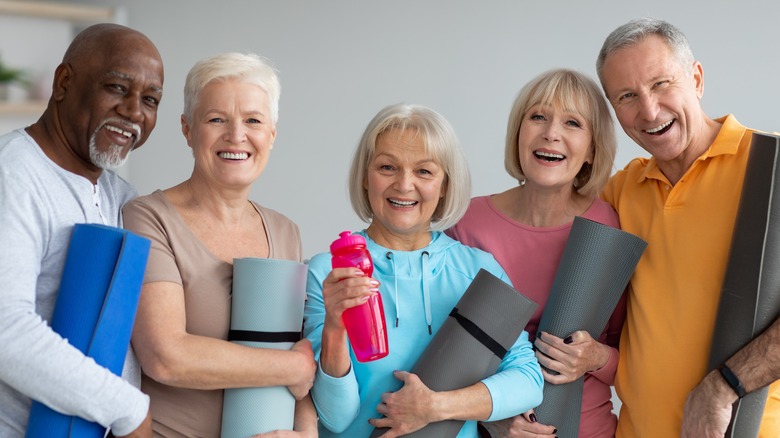 group of people with yoga mats