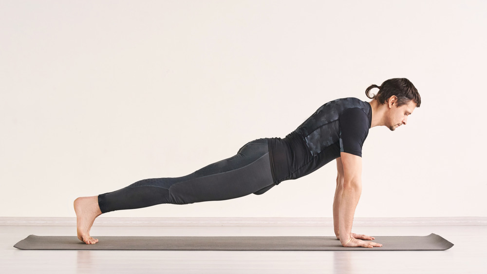 Man doing Plank Pose yoga pose