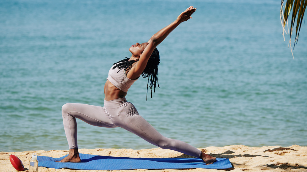 Woman in Warrior I Pose yoga pose