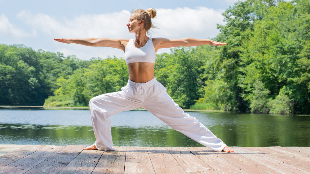 Woman in Warrior II Pose yoga pose