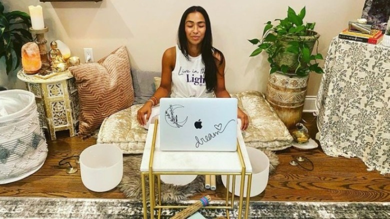 Thara's workspace with a journal on the table 