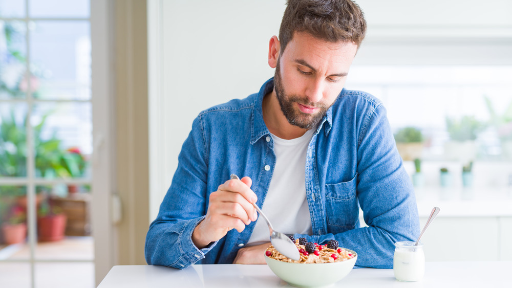 man eating cereal