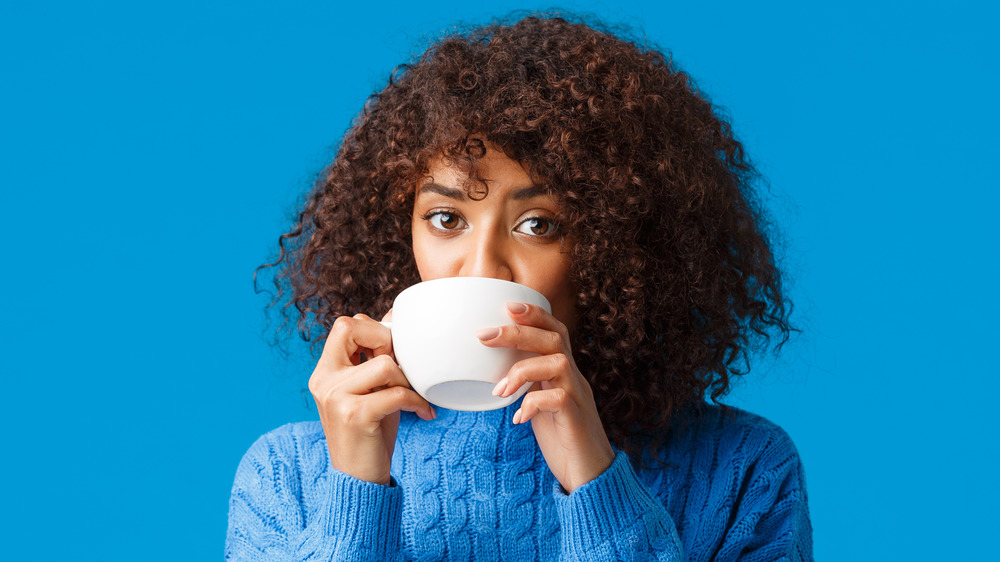 woman sipping coffee