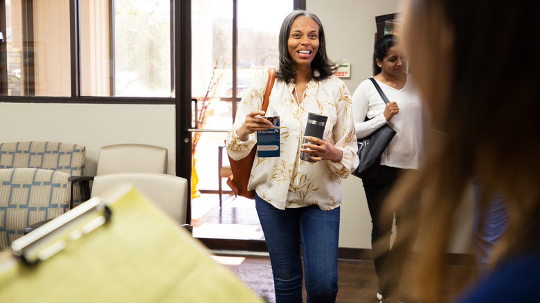 Woman walking into doctor's office