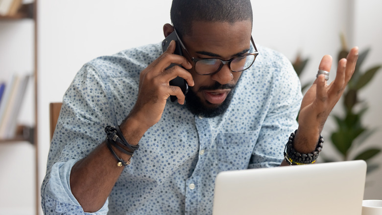 frustrated man calling on phone