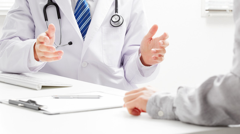 doctor talking with patient
