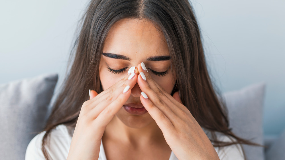 woman with sinus pain