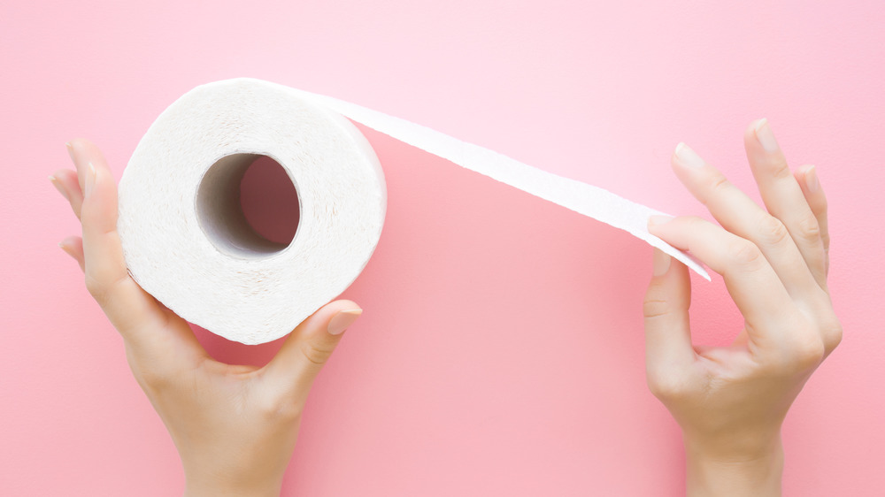 toliet paper with pink background