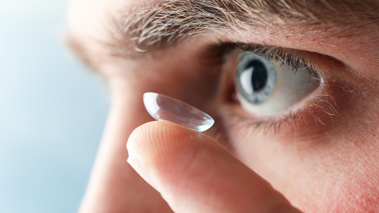 putting contact lens in eye