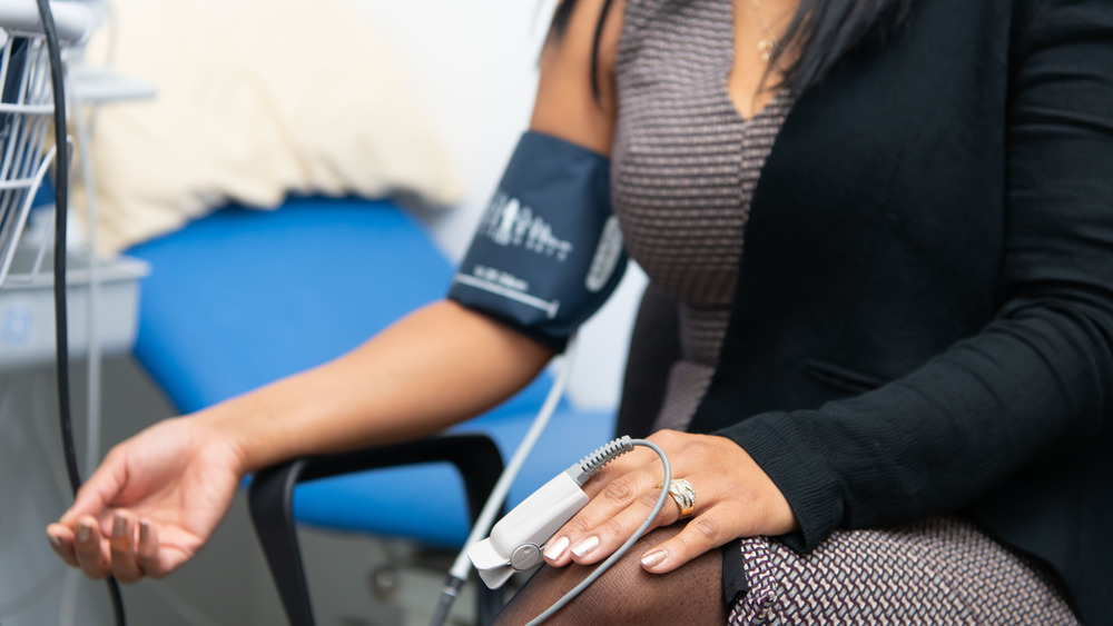 Woman getting blood pressure taken