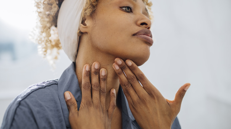 Woman looking at skin