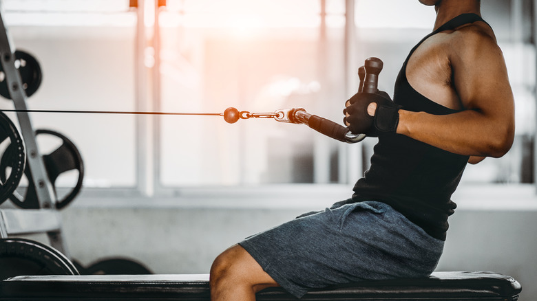 a man performing seated cable rows