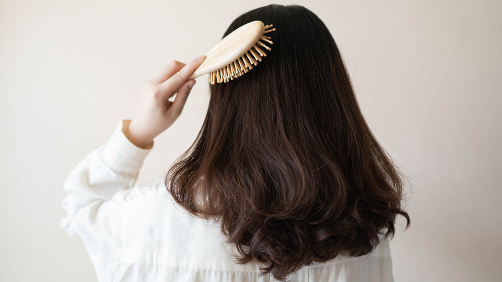 woman brushing hair