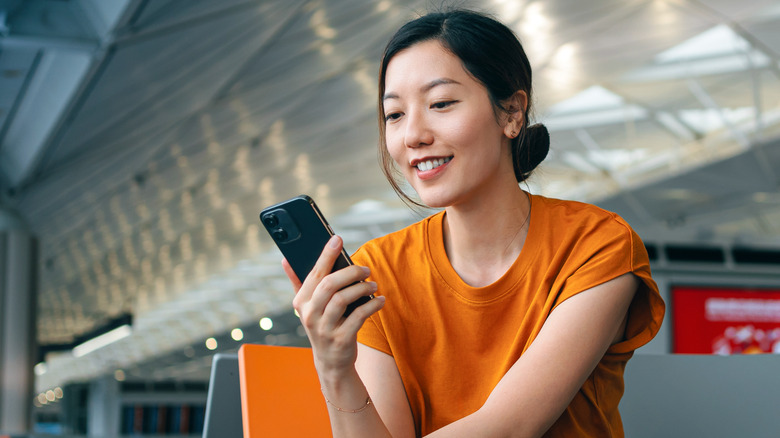 woman using her smartphone