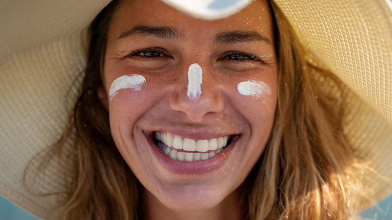 smiling woman wearing sunscreen