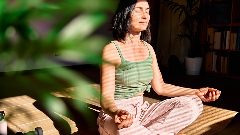 woman practicing yoga and meditation