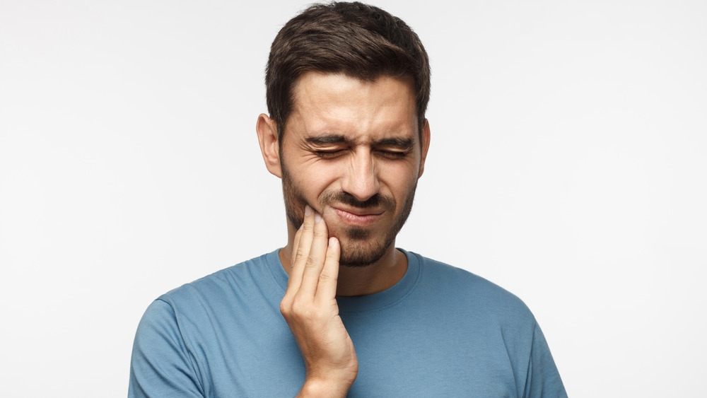 man with jaw pain