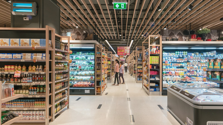 expansive grocery store with people walking