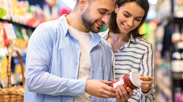 a couple reading the nutrition label