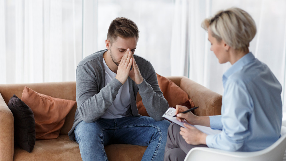 Man talking to therapist