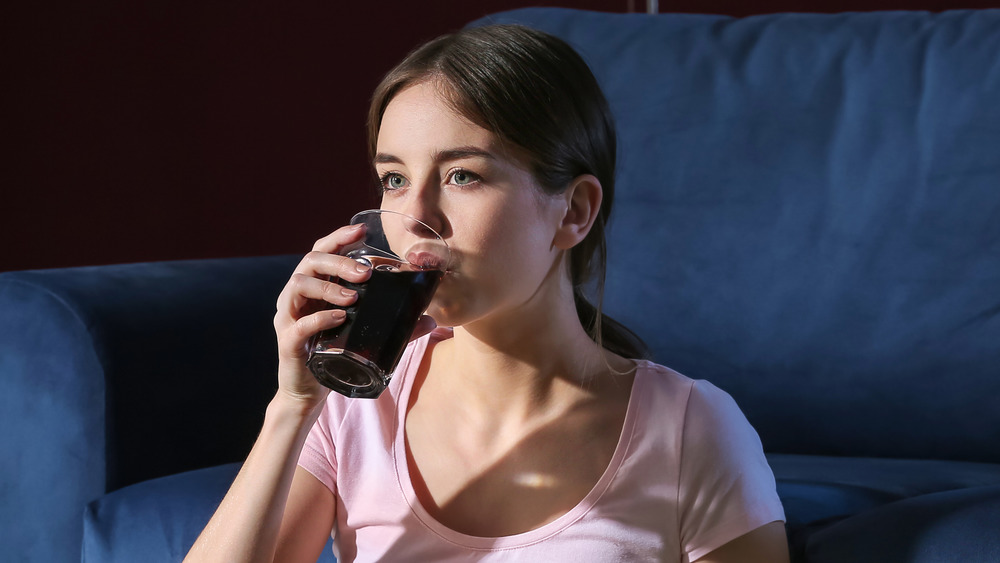 Woman drinking soda