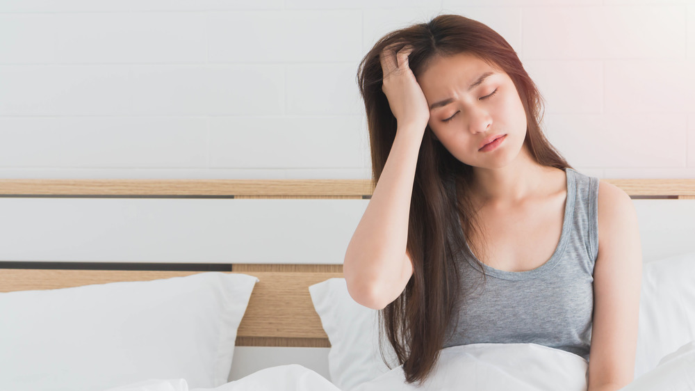 woman with headache from salt