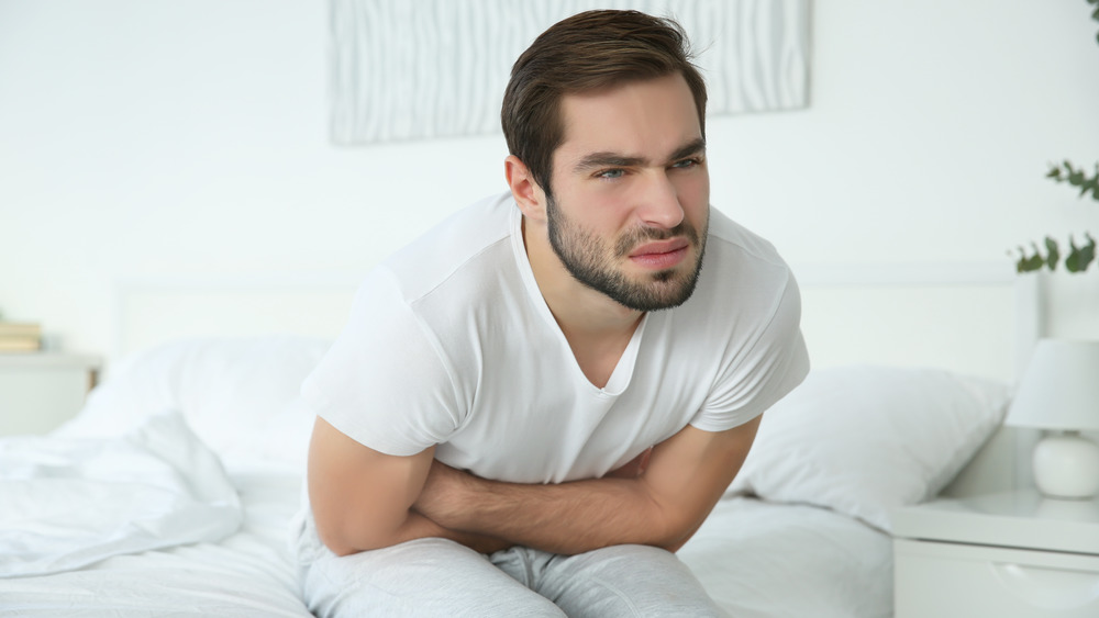 man feeling bloated from salt