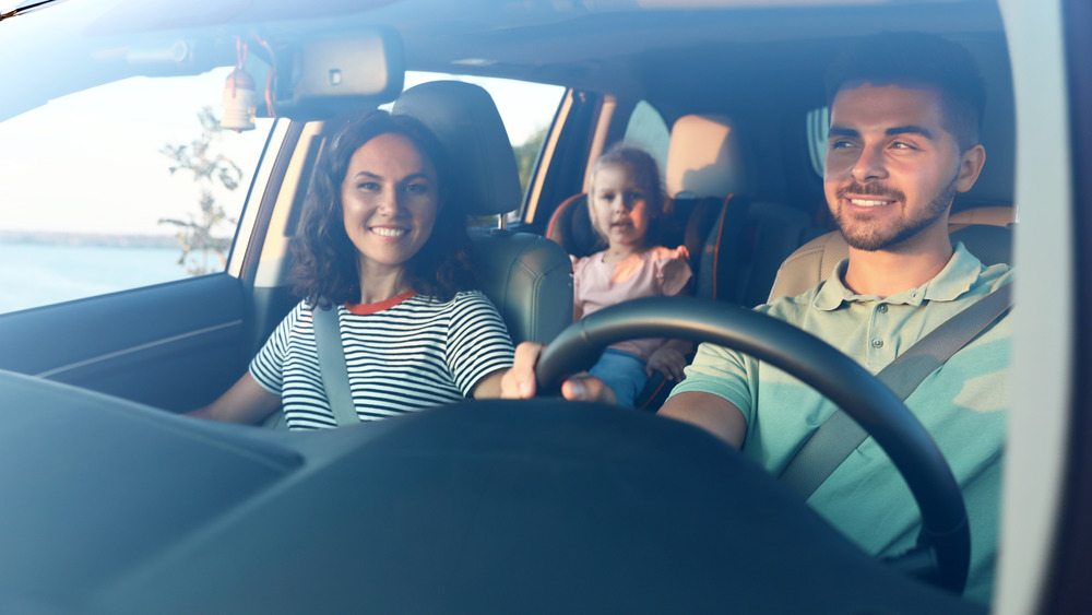 Man safely driving family