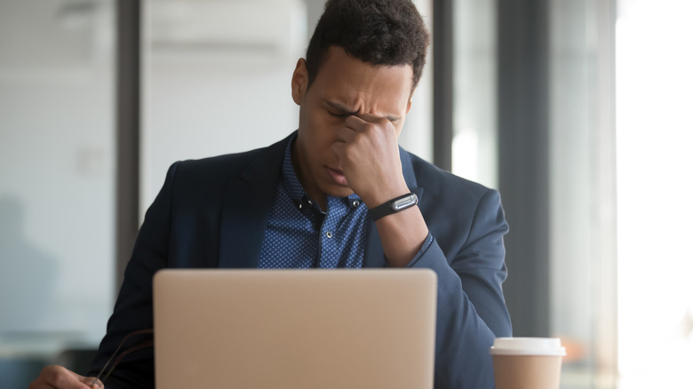 tired man at desk