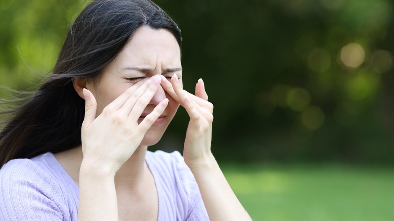Woman Rubbing Dry Eyes