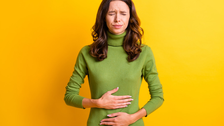 Woman with stomach discomfort
