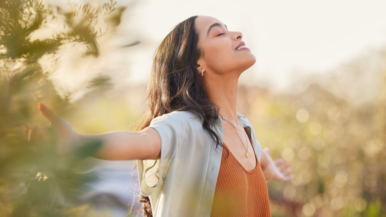 Smiling, happy woman outdoors