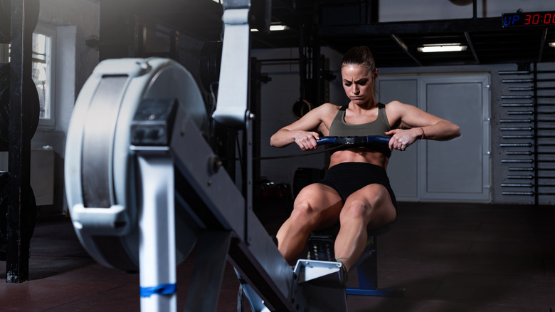 Woman using rowing machine