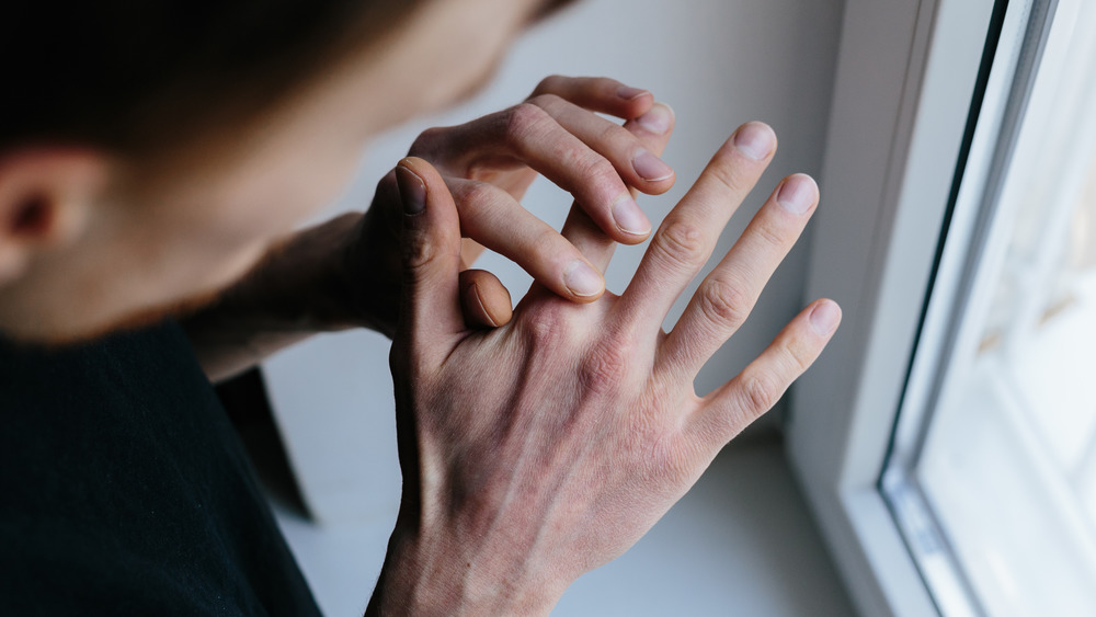 Scratching dry skin from spending too much time inside